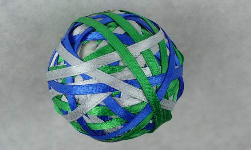 An image was here of a ball that is wrapped entirely in ribbons of three colors.