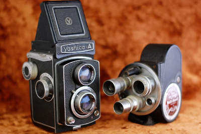An image was here of a two vintage cameras.  These are just artistic representations of multi-media.